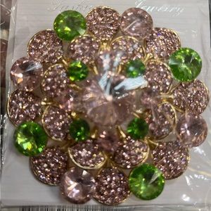 Large 3-D brooch set in gold tone with pink and green rhinestones